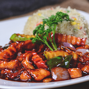 Stir-fried chicken with capsicums, onions, carrots, and zucchini sautéed in Arcadian Lounge Special onbuchan sauce.